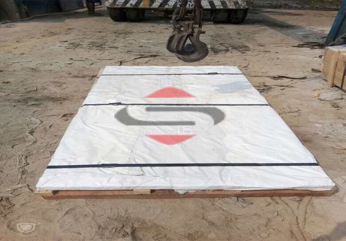 A Large White Sheet With Black Straps