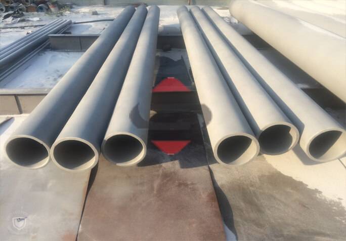Several Stainless Steel Pipe On A Concrete Surface